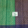Soft Silk Saree with Blouse & with Grand Pallu, two folded textiles with green and dark purple surfaces featuring gold-toned woven patterns