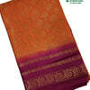 Soft Silk Saree with Blouse & with Grand Pallu, folded orange fabric with a magenta border featuring gold-toned woven patterns