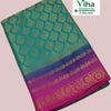Soft Silk Saree with Blouse & with Grand Pallu, a folded turquoise, blue, and magenta fabric with gold-toned patterns and a wide floral border