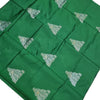 Soft Silk Saree with Blouse & Pallu, a folded green fabric featuring twelve silver-toned triangular floral motifs arranged in a grid pattern