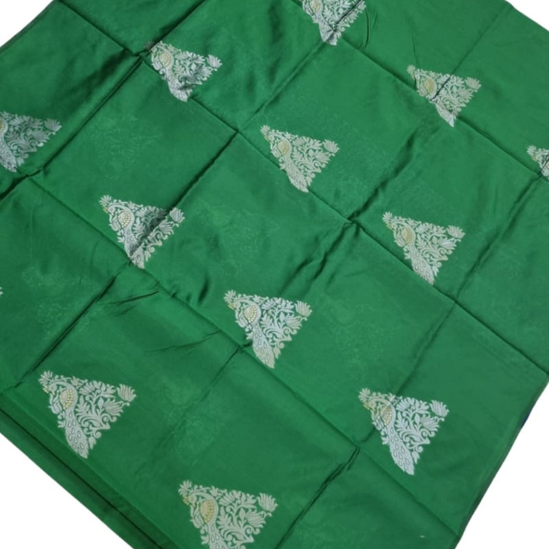 Soft Silk Saree with Blouse & Pallu, a folded green fabric featuring twelve silver-toned triangular floral motifs arranged in a grid pattern