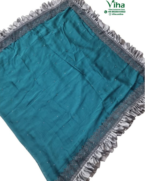 Designer Saree with Ruffle Work & with Blouse, a teal fabric with scattered white dots and a ruffled grey border