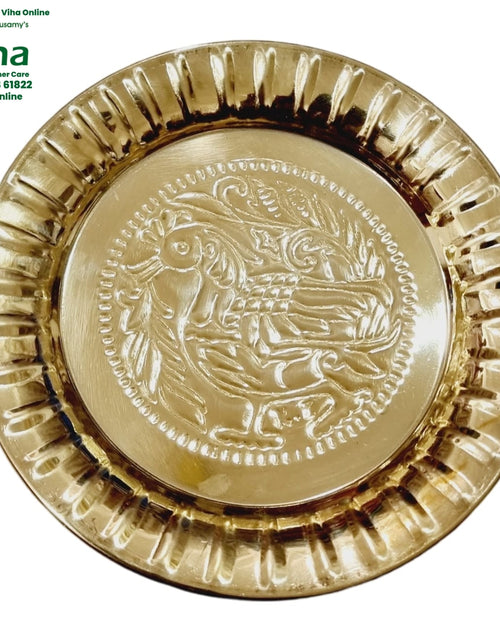 Peacock Pooja Plate, brass plate with peacocks embossed among foliage, a beaded ring and a wide fluted rim