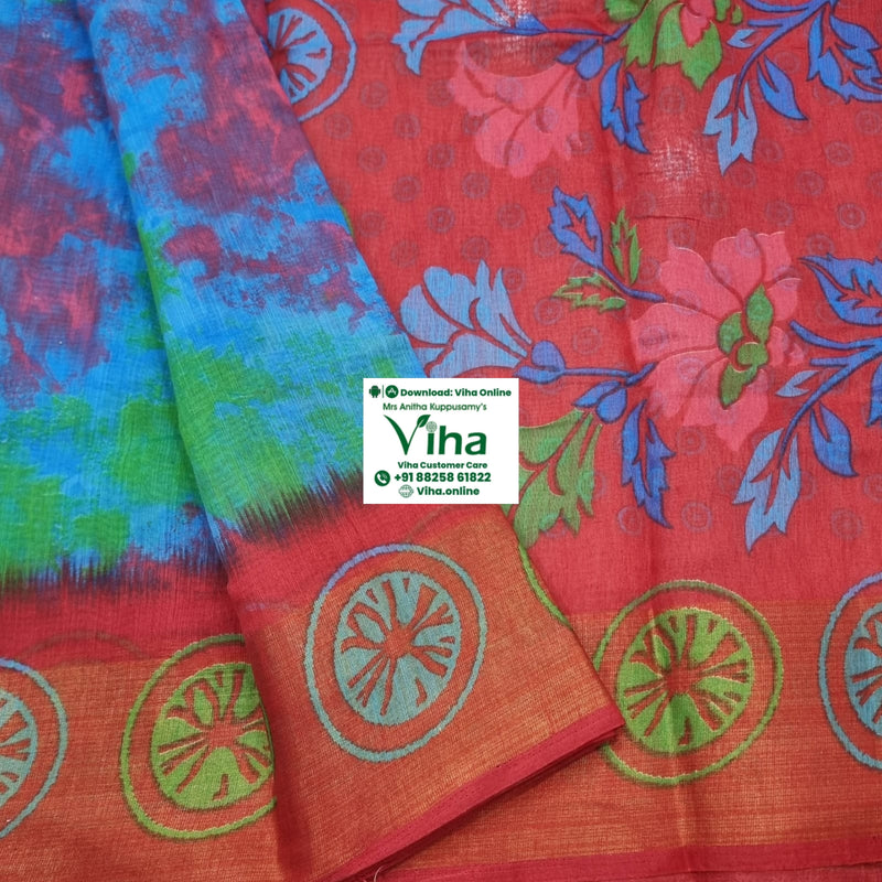 Soft Cotton Saree With Blouse, a red fabric features blue and green floral patterns alongside a blue tie-dye section and a border with seven circular motifs