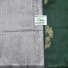 Cotton Silk Saree with Blouse, a green fabric featuring a wide grey-and-silver woven border with a chevron pattern and a leafy vine design