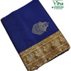 Cotton Silk Saree With Blouse & With Pallu, a folded blue fabric featuring a gold-toned border with peacock patterns and one large floral motif