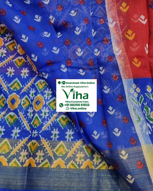 Soft Cotton Saree with Blouse, a folded fabric displays blue, red, purple, and green sections patterned with white, yellow, and red motifs