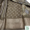 Cotton Silk Saree with Blouse, an olive-brown patterned fabric featuring white floral motifs and an ornate metallic-toned border