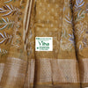 Cotton Silk Saree with Blouse, a brown-toned fabric with white and green botanical prints and a textured metallic border