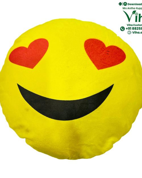 Smiley Soft Baby Pillow, a round yellow cushion with red heart-shaped eyes and a curved black smile