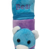 Baby Feeding Bottle Cover with Zip, a blue and purple plush bear cover with embroidered text, two ears and a black nose