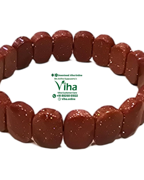 Red Gold Stone Bracelet with sparkling reflective inclusions