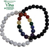 Couple Bracelet Crystal, two beaded bracelets with smooth white marbled beads, glossy black beads, multicolored beads, and silver-toned spacers