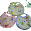 Baby Bib, three round fabric baby bibs in light green, pink, and light blue, featuring colorful clown and ball prints with matching bound edges