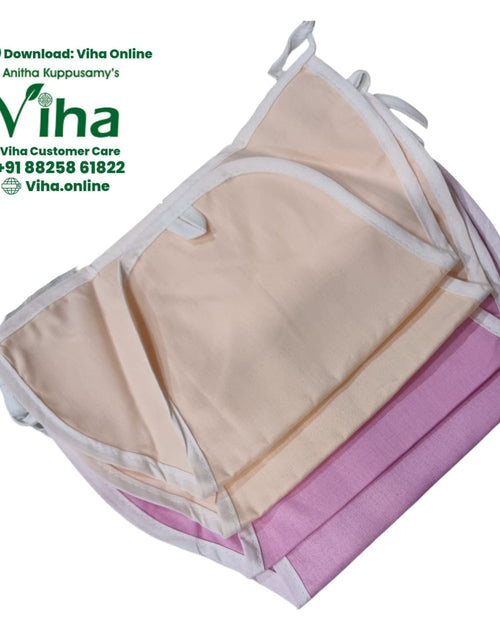 Baby Langott Pure Cotton, folded fabric items in beige and pink with white binding edges and ties