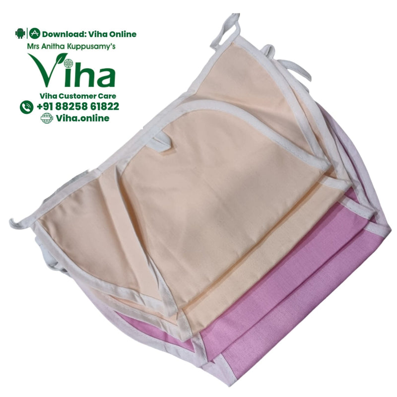 Baby Langott Pure Cotton, folded fabric items in beige and pink with white binding edges and ties