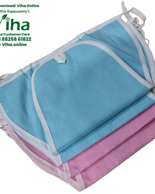 Baby Langott Pure Cotton, a stack of folded light blue and pink fabric items with white trim and ties