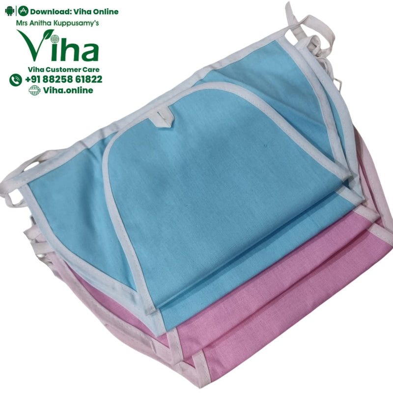 Baby Langott Pure Cotton, a stack of folded light blue and pink fabric items with white trim and ties