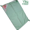 Baby Sheet With Towel - Water Proof, a light green rectangular fabric wrap with knotted corners and a patterned corner pocket