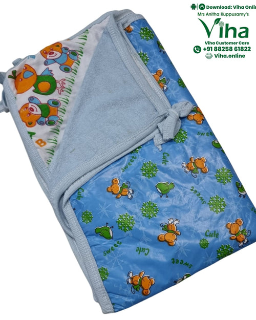 Folded light blue baby wrap with a cartoon bear and bird print