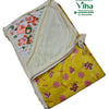 Baby Sheet with Towel - Water Proof, a folded yellow blanket featuring brown bear and pink bird graphics with tied fabric corners