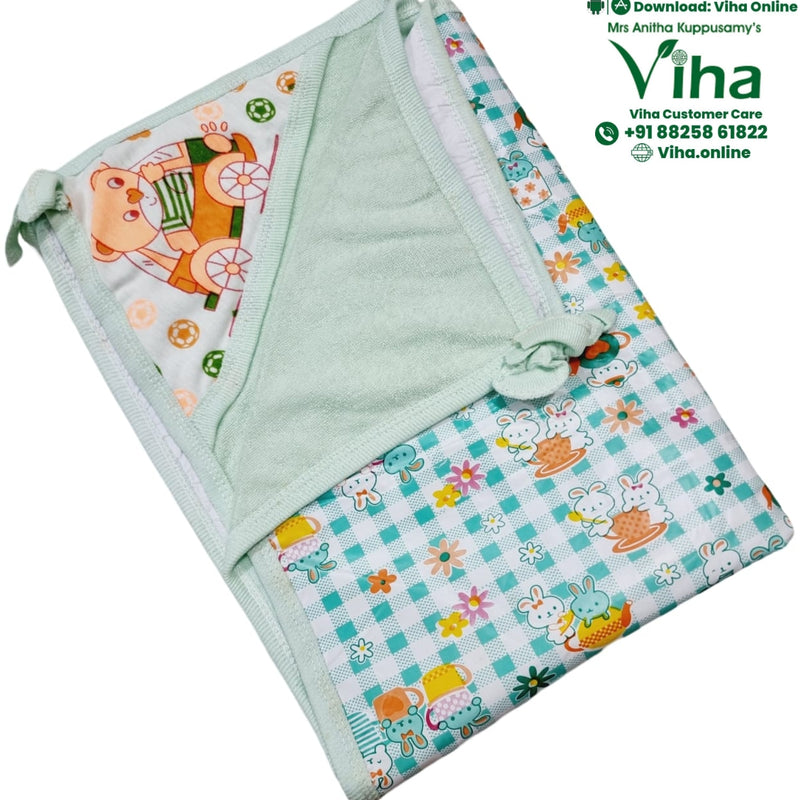 Baby Sheet With Towel - Water Proof, a folded light-green and white textile piece featuring cartoon rabbit and bear patterns with small floral and ball details