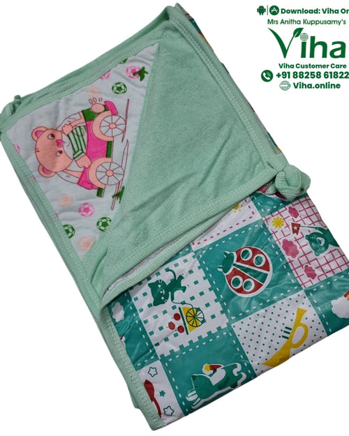 Baby Sheet With Towel - Water Proof, folded green and white textile featuring patterned cartoon prints, sewn hems, and tied corners