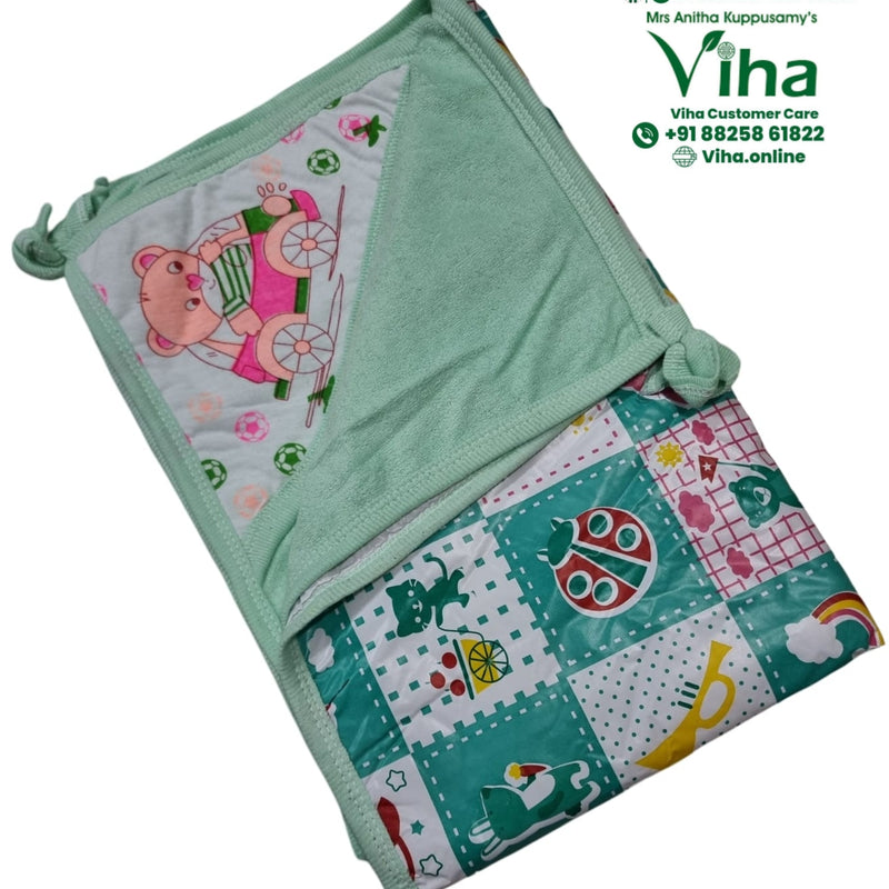 Baby Sheet With Towel - Water Proof, folded green and white textile featuring patterned cartoon prints, sewn hems, and tied corners
