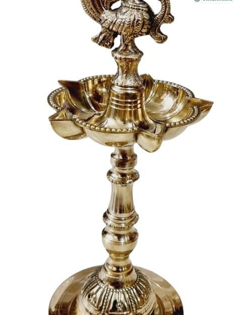 Annapakshi designer kuthu vilakku in brass, paired swan finial above a five-point oil well and fluted base