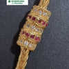 Impon Mugappu Chain, a gold-toned chain with a tube-shaped pendant in alternating bands of clear and red stones