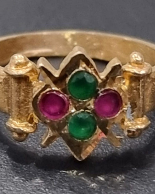 Impon Ring in a gold-tone band set with two green stones and two pink stones in a diamond pattern