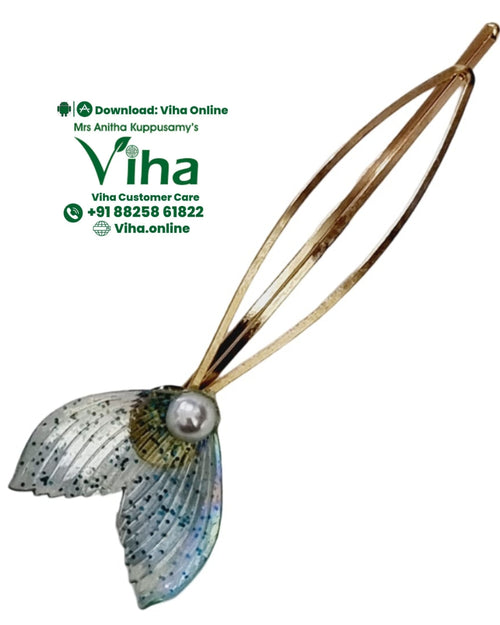 White Bead Wing Hair Clip, a gold-toned metal hairpin featuring a glossy, textured, iridescent fishtail shape accented with one white bead