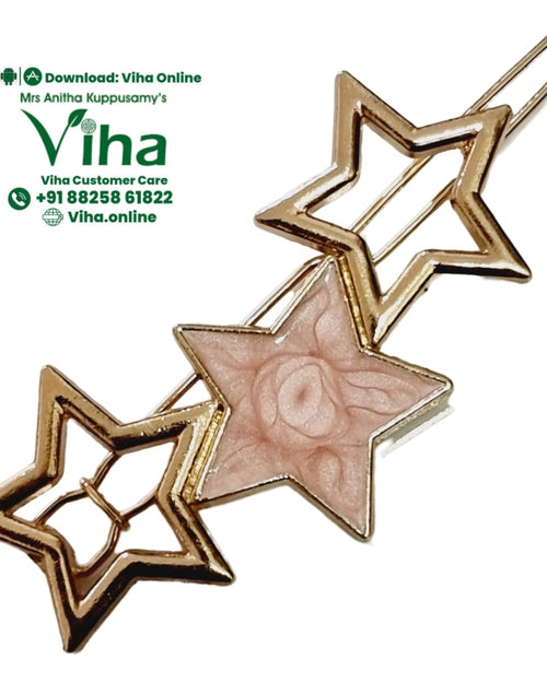 Star Hair Clip, a gold-toned clip with three star shapes, featuring an empty star, a pink star-shaped inlay with a rose pattern, and an empty star at top