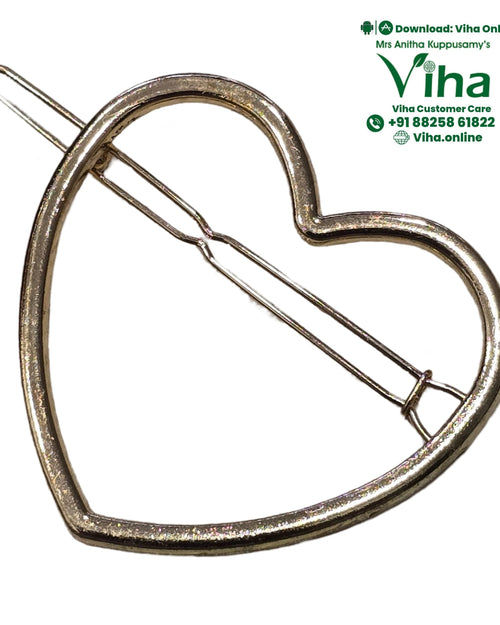 Heart Shape Hair Clip, a gold-toned heart-shaped frame with a hinged clasp extending diagonally across the center