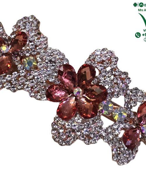Hair Clip in a floral design covered with clear rhinestones and rose-pink crystal petals