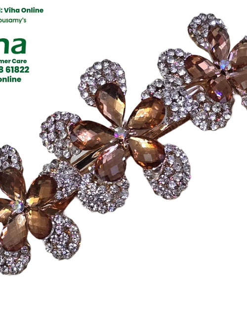 Hair Clip Studded with Stones, three overlapping floral motifs featuring amber-coloured faceted teardrop stones and pavé clear stones on silver-toned metal