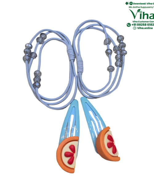 Hair Band & Hair Clip, two light-blue hair clips featuring orange slice charms, alongside two light-blue elastic cords threaded with translucent grey beads