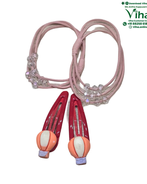 Hair Band & Hair Clip, two pink elastic bands decorated with clear beads and two glossy red snap hair clips featuring hot air balloon charms