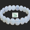 Opal Bracelet, a bracelet of twenty-four translucent white oval beads with polished finishes arranged in a circle