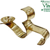 OM Athma Deepam, a shiny gold-toned metallic sculpture formed of undulating curved ribbons featuring one attached bowl on the left end