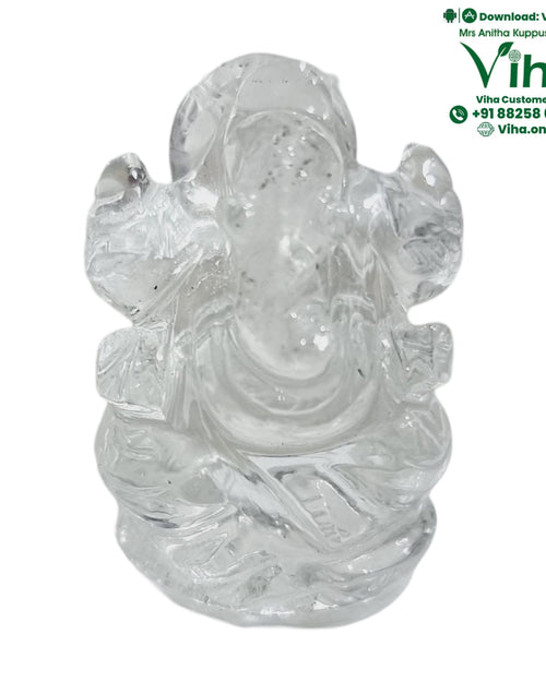 Sphatik Ganesha, a glossy, transparent, colorless carved figurine depicting a seated anthropomorphic figure with an elephant-like head and four arms