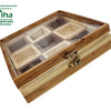 Wooden Masala Box, a brown rectangular wooden box with a transparent lid containing nine inner compartments and a brass-toned latch closure on the front