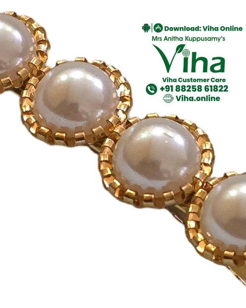 White Bead Hair Clip with four round pearl beads set in a gold-tone row