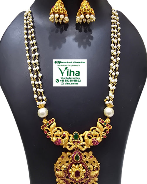 White Beads Chain Set, a gold-toned jewelry set with white beads, red and green stones, featuring a three-strand necklace and matching jhumka earrings