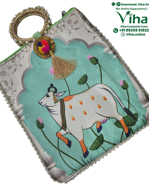 Bangle Handle Cow Bag with circular handle and cow illustration