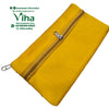 Designer Purse, a rectangular mustard-yellow pouch with two parallel silver-toned zippered compartments and two zipper pulls on a white background