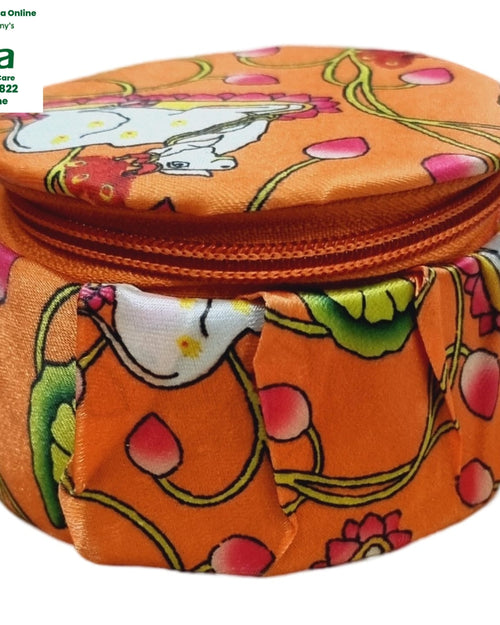 Storage Box, an orange fabric round zipped box with floral and white figure prints