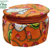 Storage Box, an orange fabric round zipped box with floral and white figure prints