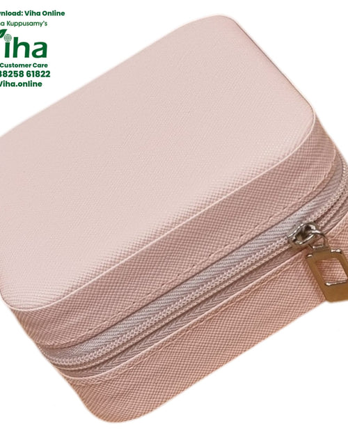 Travelling Jewel Case, a pink textured square case with a grey zipper and one gold-toned rectangular zipper pull