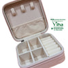 Travelling Jewel Case, an open pink-textured square box featuring beige lining, three hanging loops, an elasticated pocket, and six partitioned sections